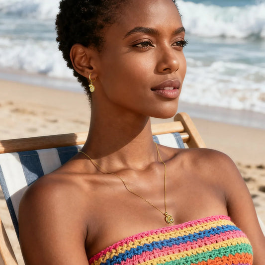 Gold conch jewelry set (necklace + earrings) with spiral design