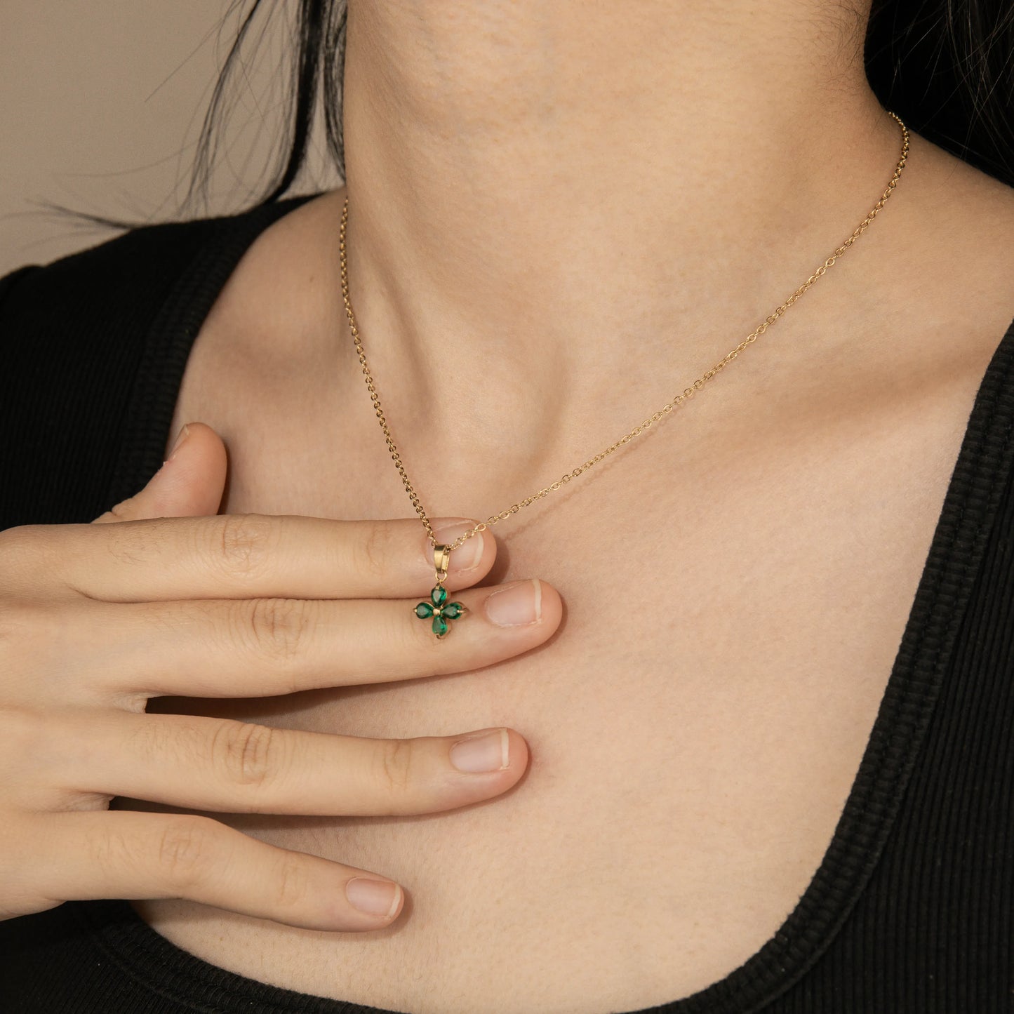 Ajatine four leaf clover necklace with gold chain and green crystal pendant