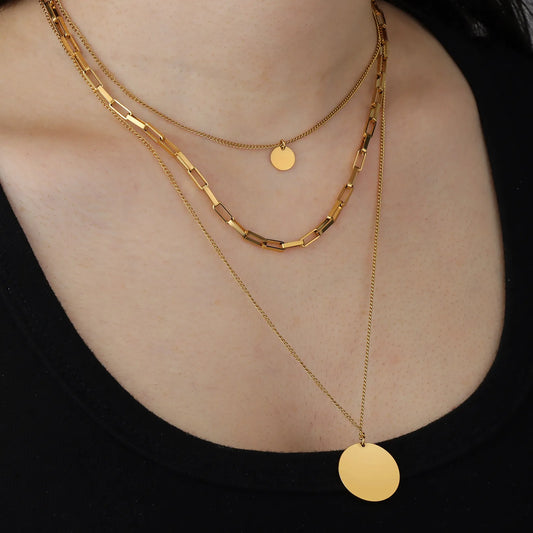 Ajatine gold layered necklace set with multi - strand chains and disc pendants