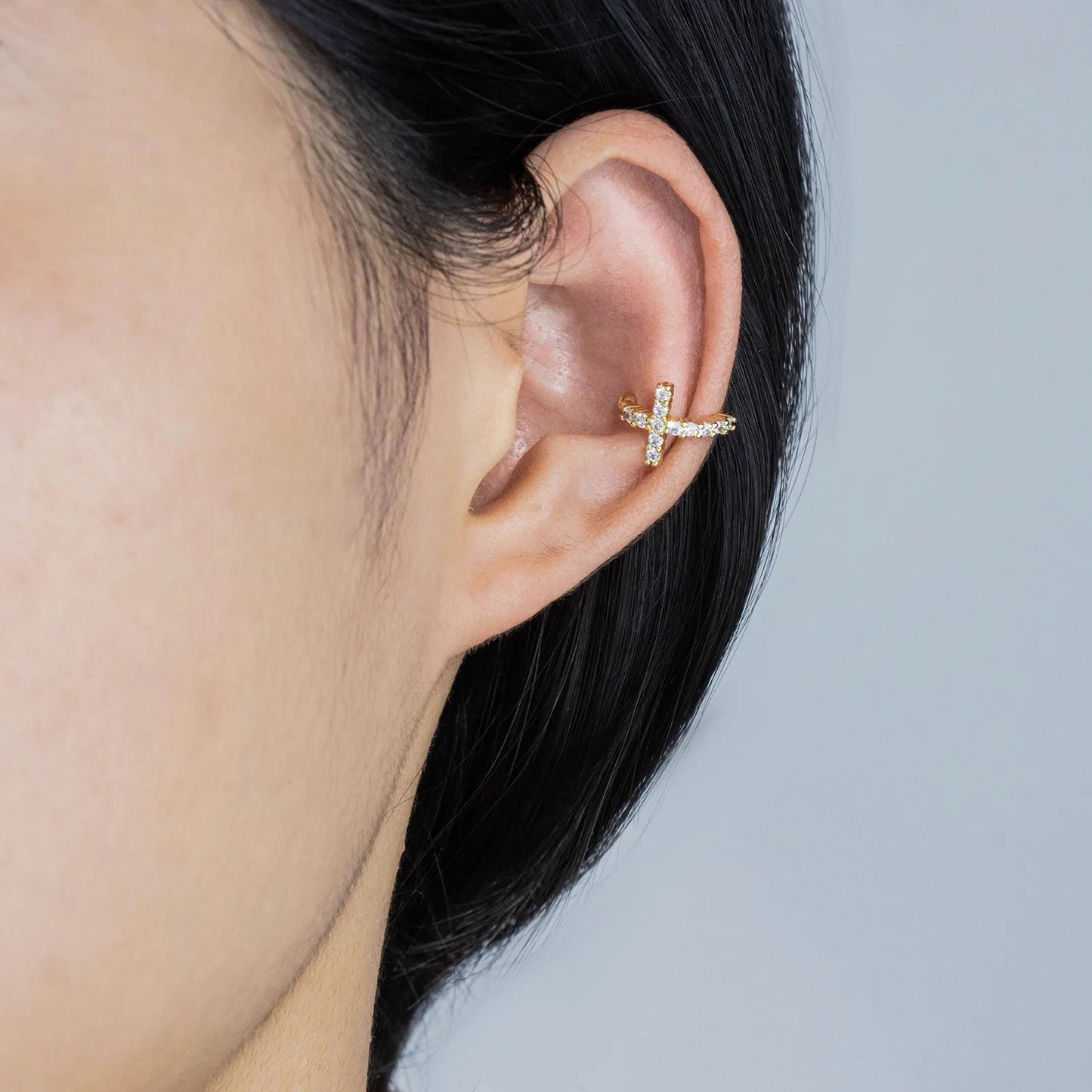 Ajatine asymmetric cross CZ ear cuffs in gold, featuring sparkling stones for elegant daily and party wear