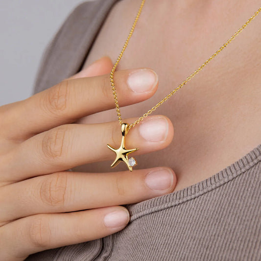Ajatine 14K gold-plated brass four-pointed star necklace (with zircon on the side), simple design, suitable for everyday wear.