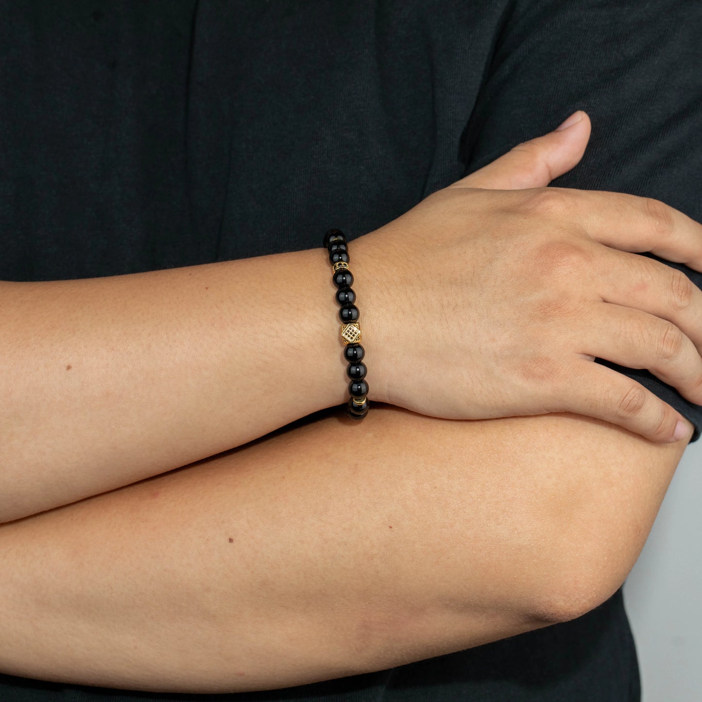 Ajatine black natural stone beaded bracelet with gold accents