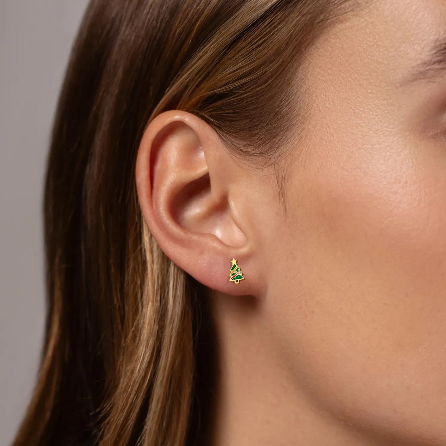 Ajatine Christmas tree stud earrings, gold-plated festive holiday jewelry with glittery details