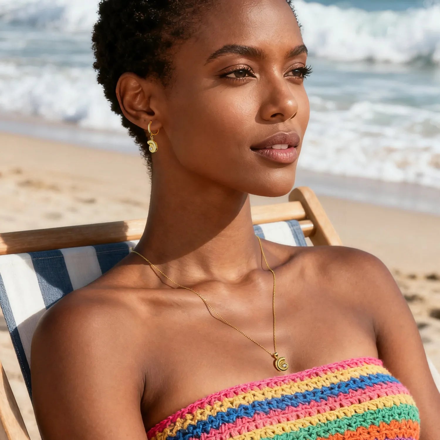 Gold conch jewelry set (necklace + earrings) with spiral design