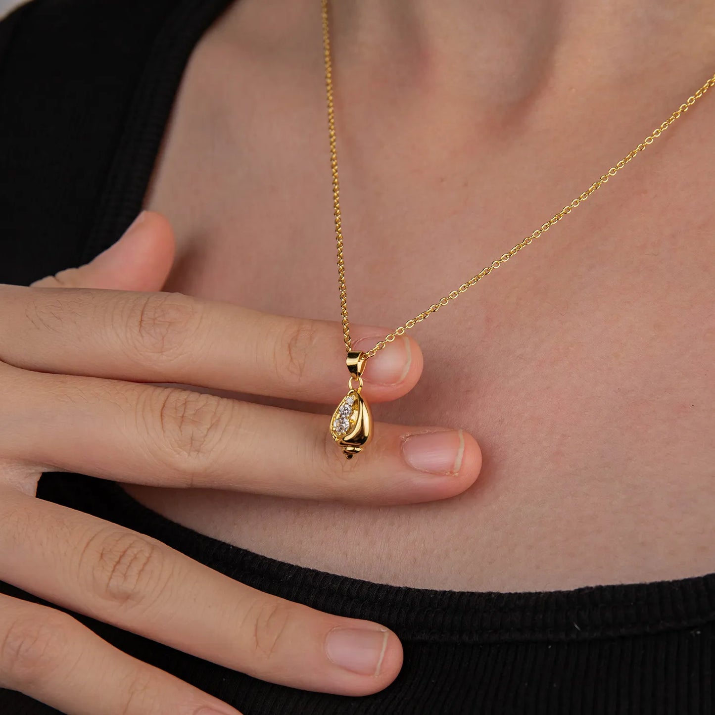 Dainty gold tone conch shell pendant necklace with zircon, ocean-inspired accessory
