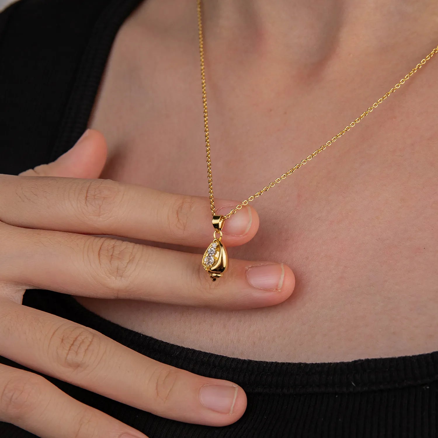 Dainty gold tone conch shell pendant necklace with zircon, ocean-inspired accessory