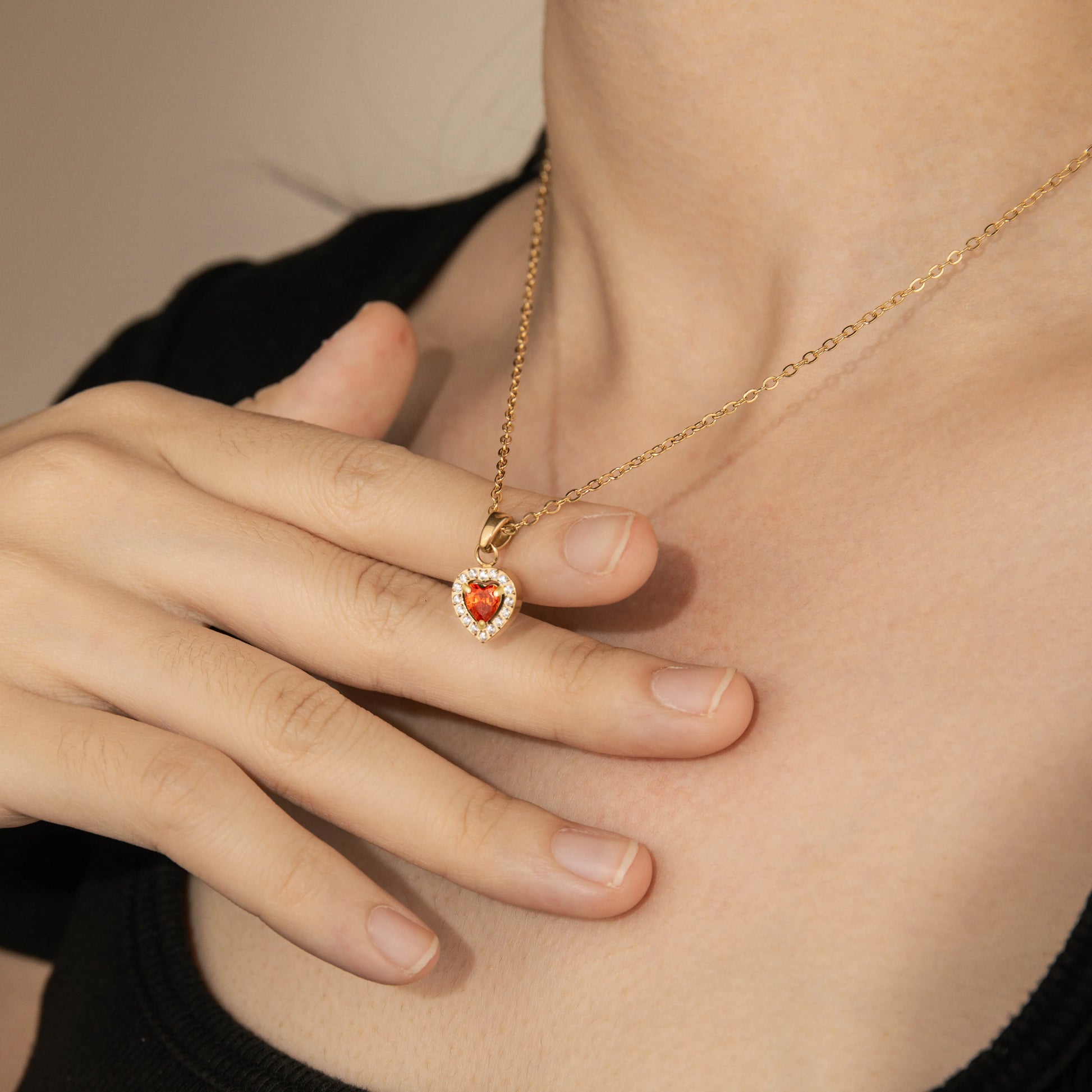 Heart shaped orange crystal gold necklace with cubic zircon pendant