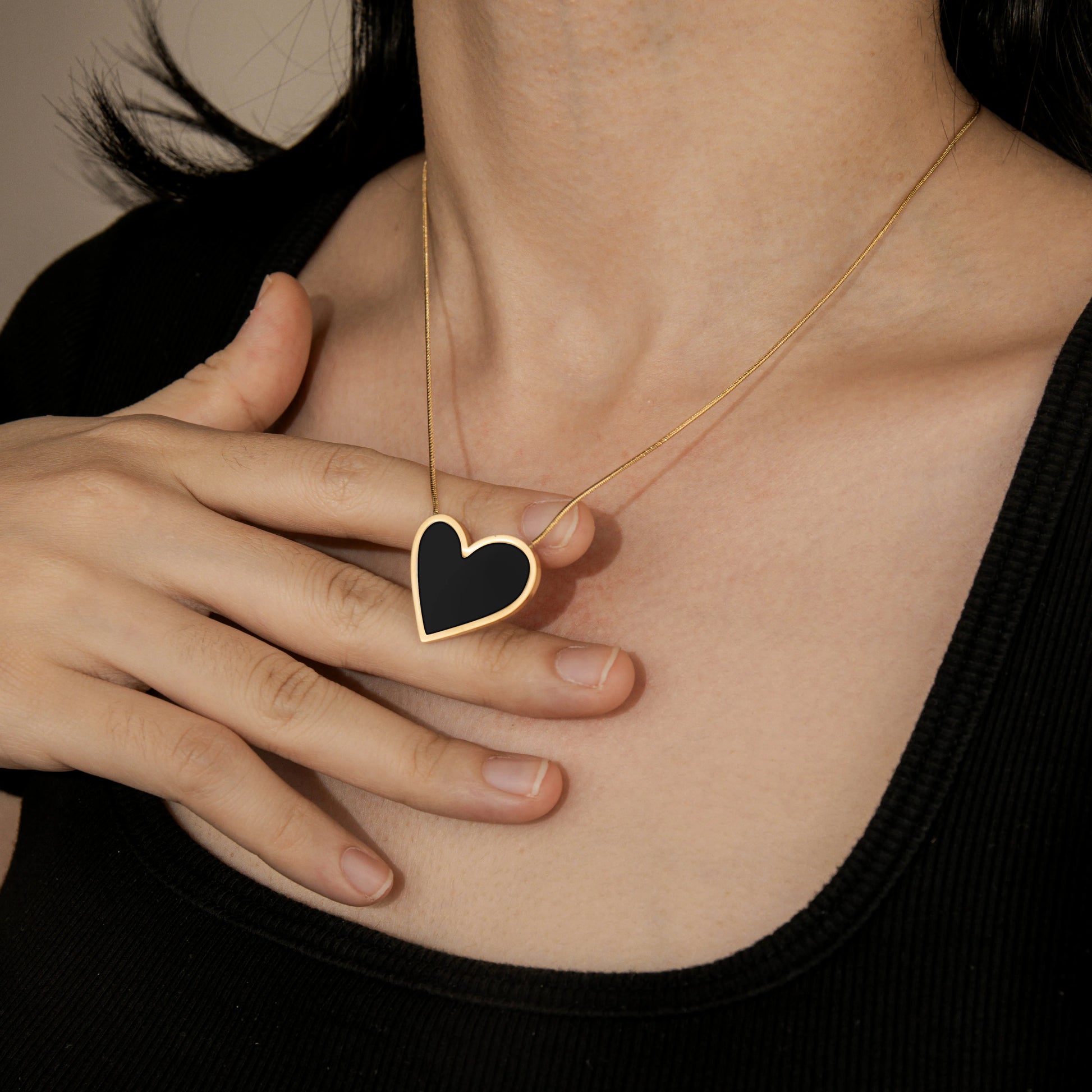 Ajatine black heart pendant necklace with gold plated chain