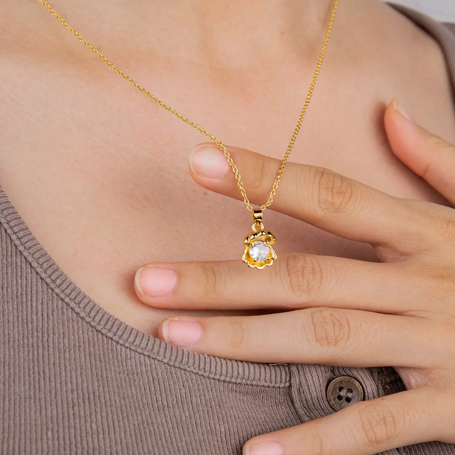 Dainty gold shell pendant necklace with sparkling accent