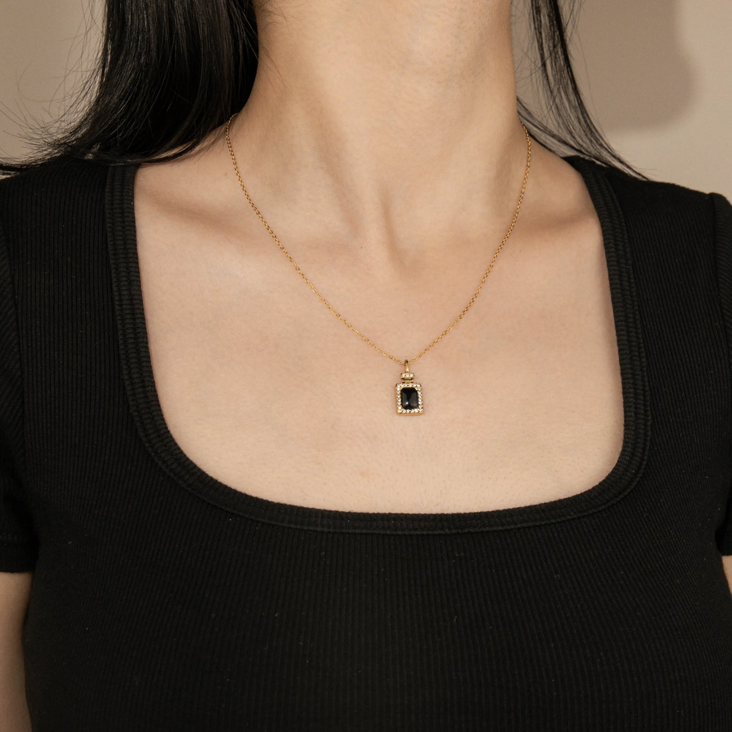Ajatine gold square pendant necklace with black stone and cubic zircon