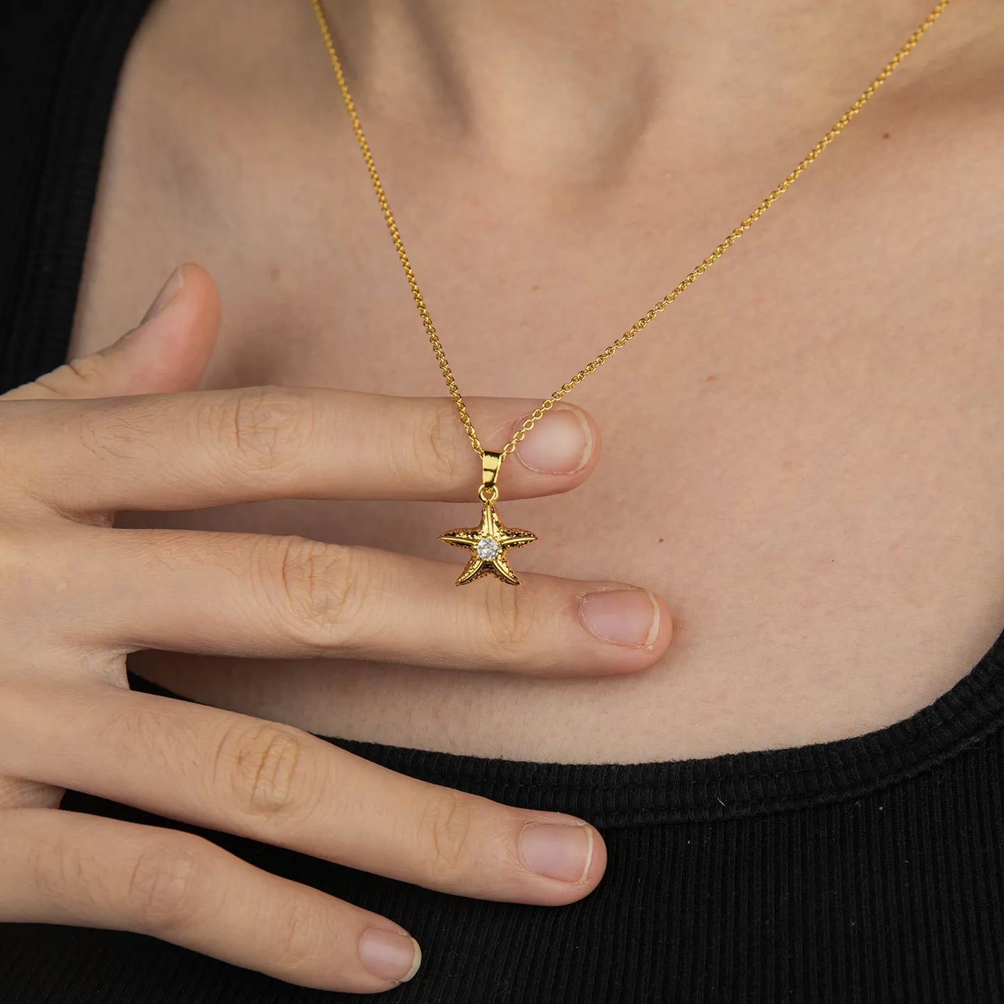 Ajatine gold starfish pendant necklace with sparkling accent for summer beach style