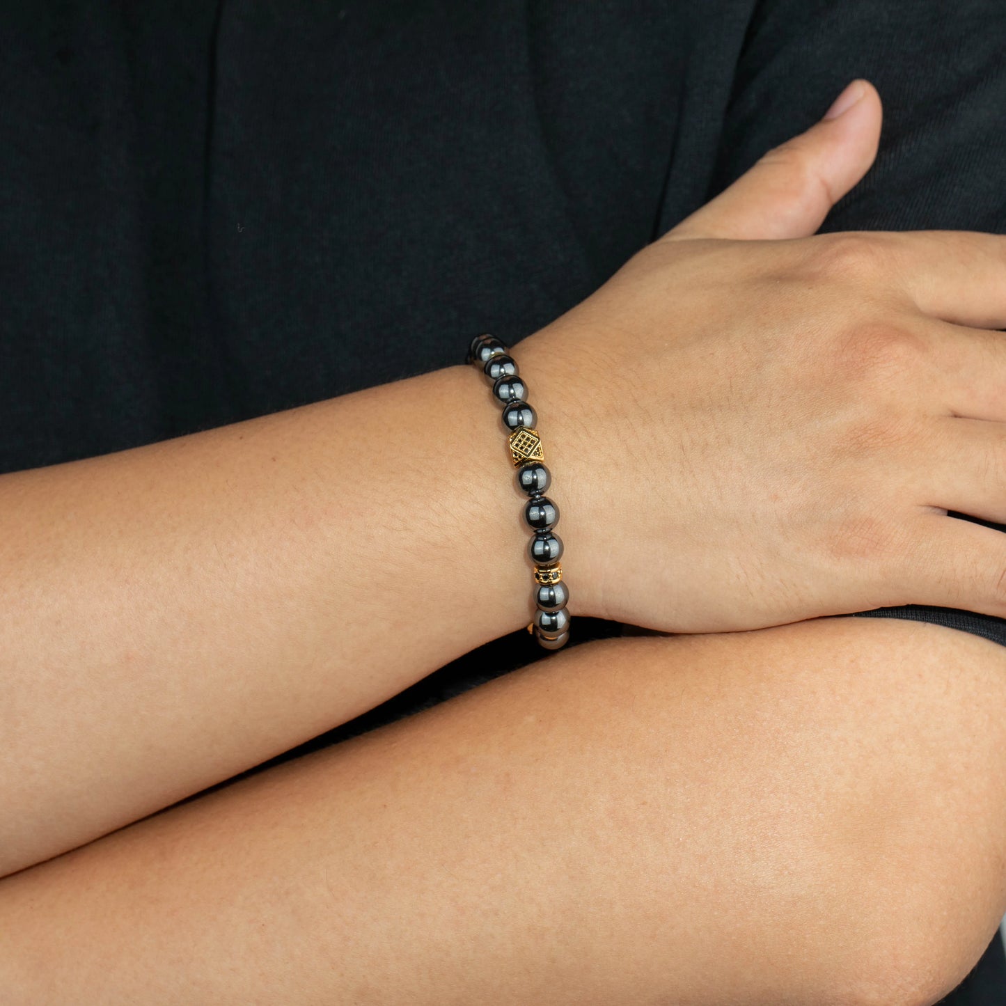 Ajatine gun black natural stone beaded bracelet with gold accents