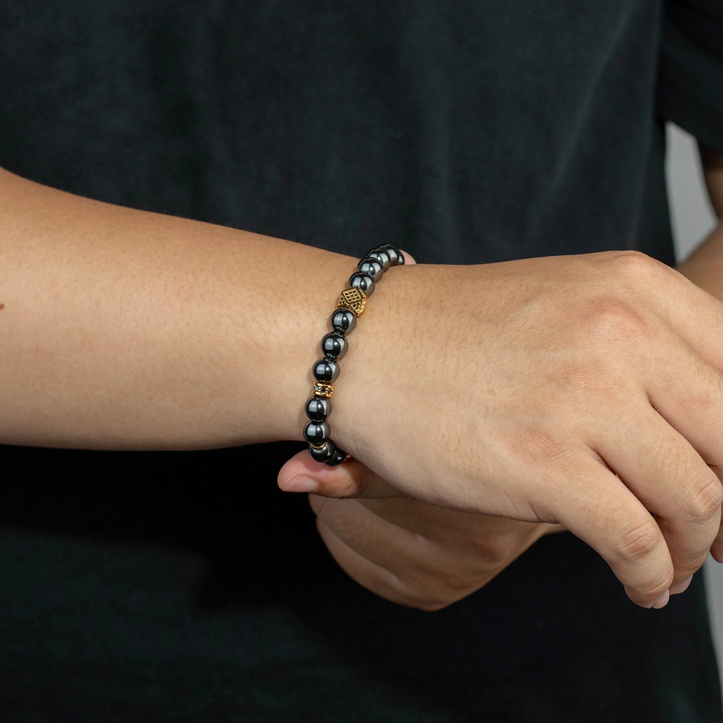 Ajatine gun black natural stone beaded bracelet with gold accents