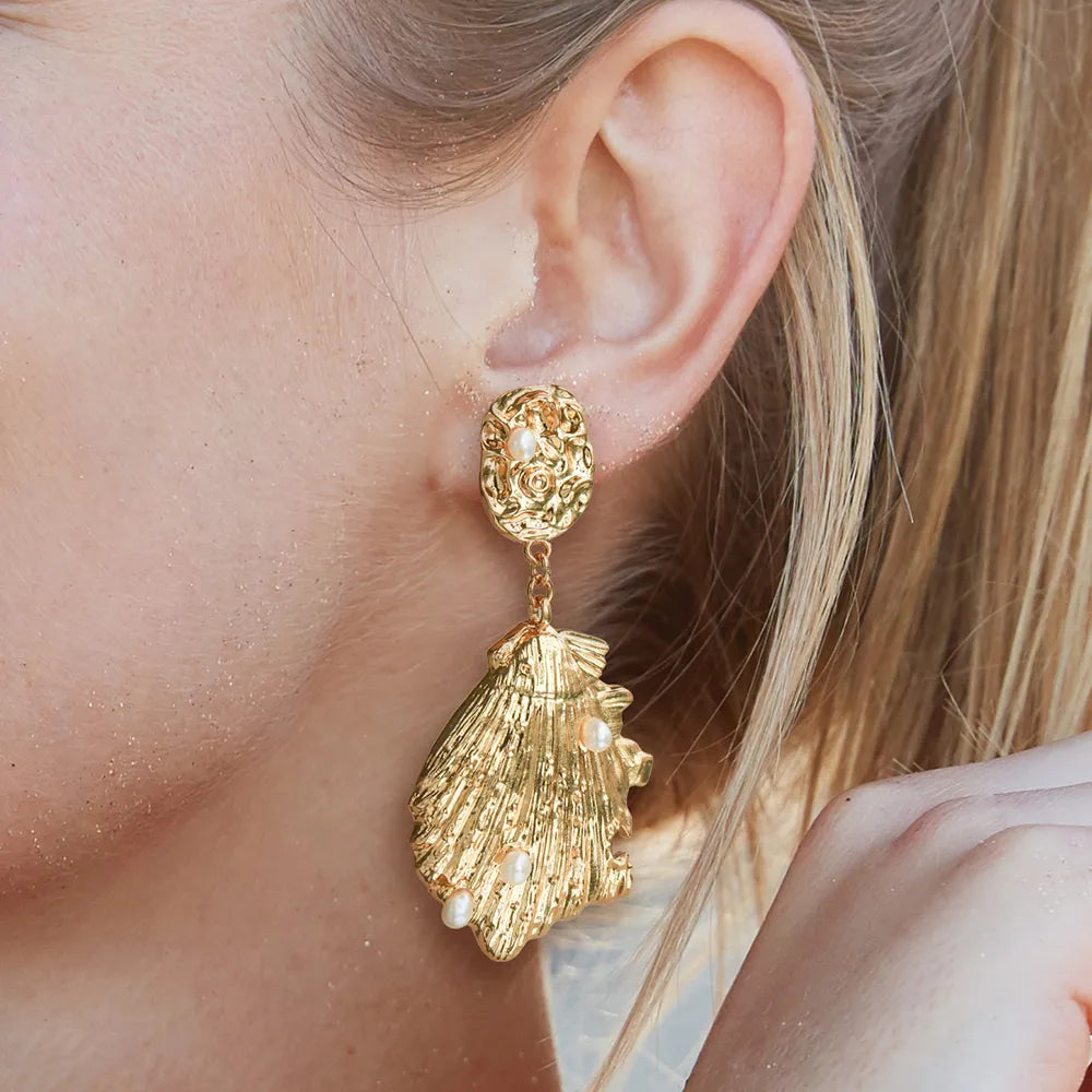 Ajatine gold seashell drop earrings with pearls, ocean-inspired statement jewelry for women