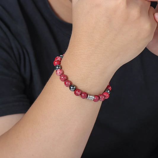 Bead bracelet with red and black stones, stainless steel clasp, fashionable accessory.