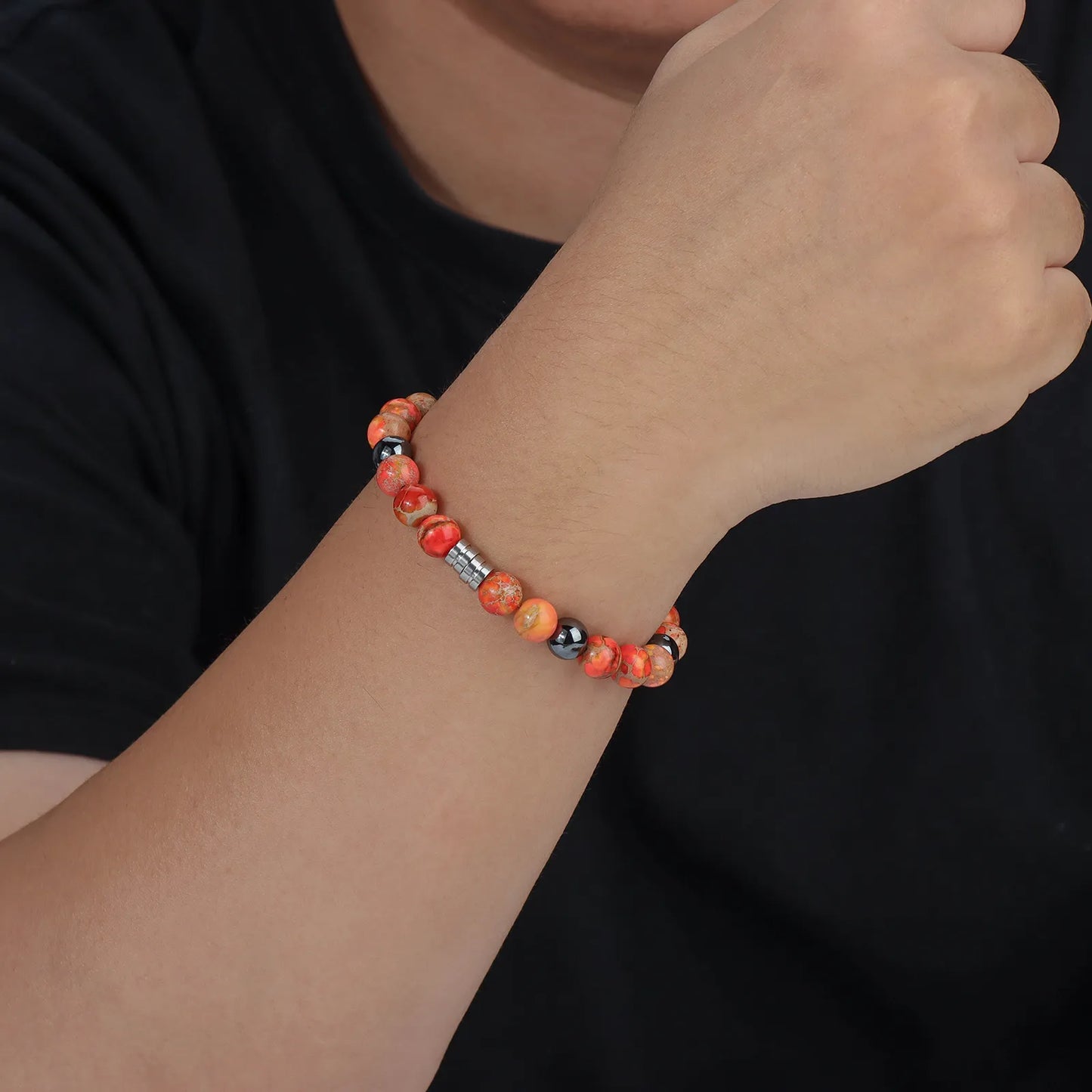 Bead bracelet with colorful stones and black beads, showcasing the design and details.