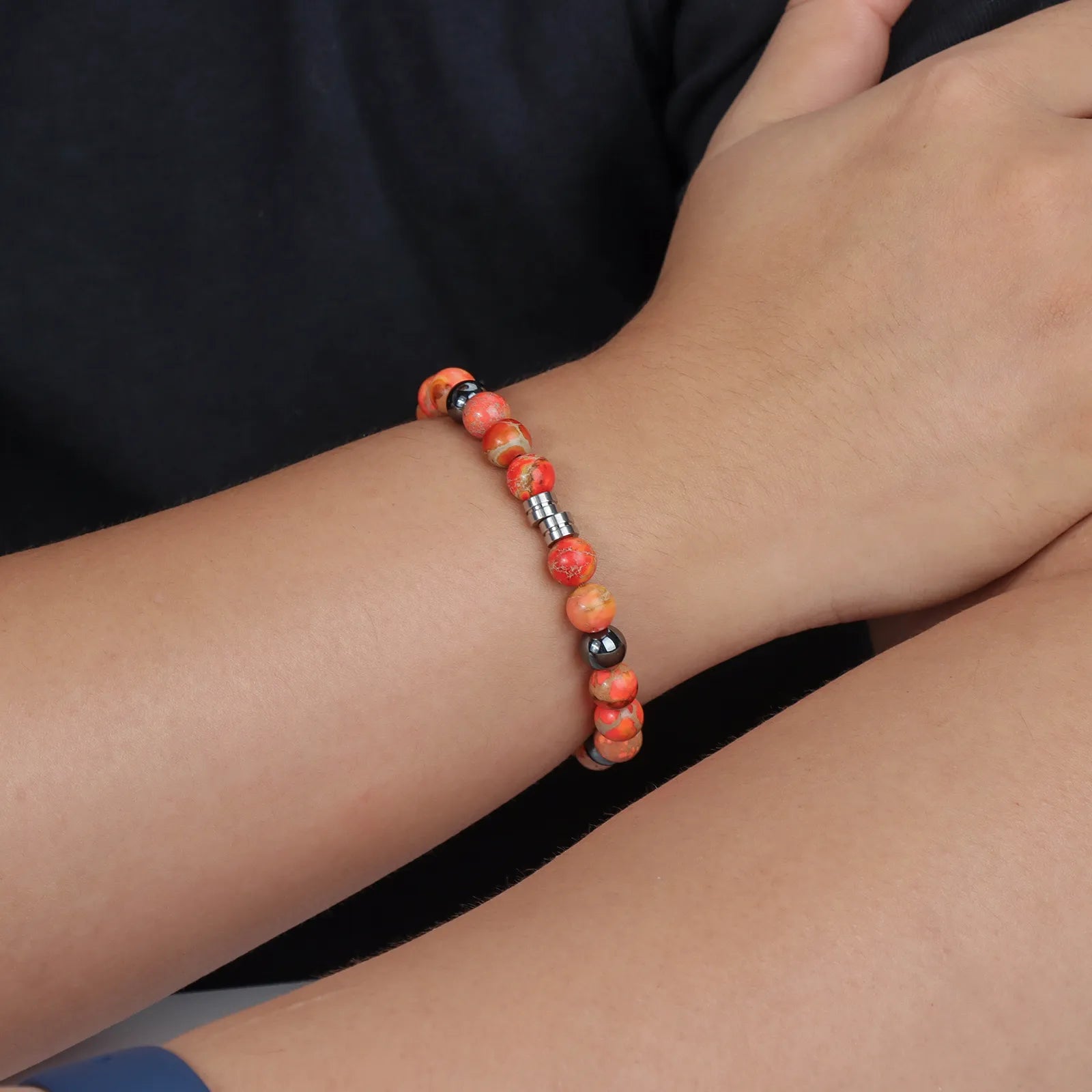 Bead bracelet with colorful stones and black beads, showcasing the design and details.
