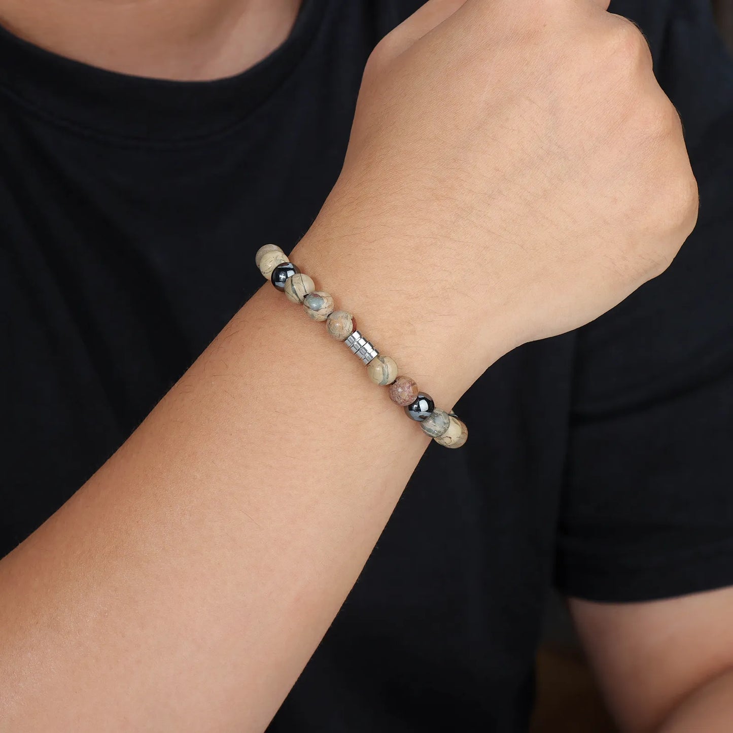 Beaded bracelet with mixed - color stones and stainless - steel detail, showcasing stylish design for men and women.