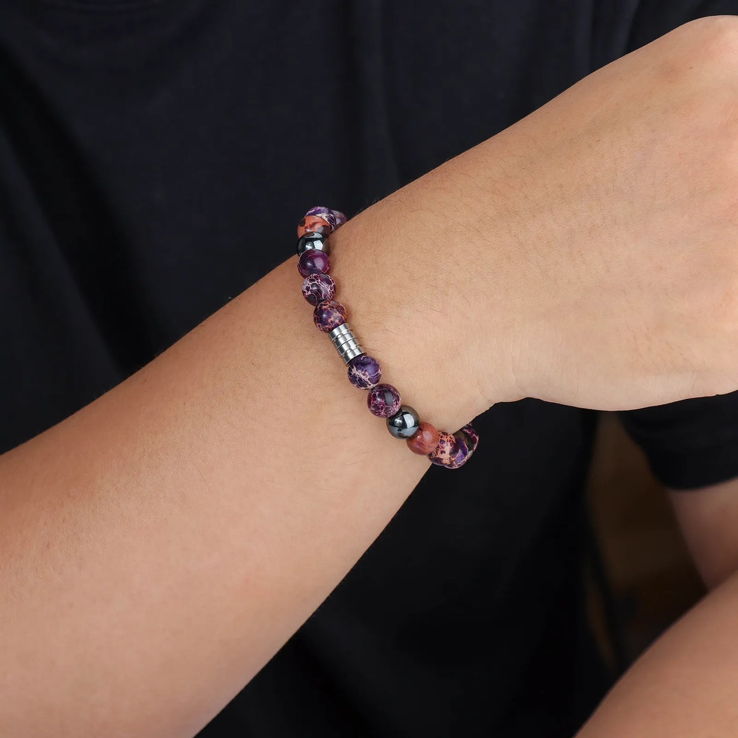 Beaded bracelet with hematite stones and stainless steel, showcasing stylish design for daily wear.