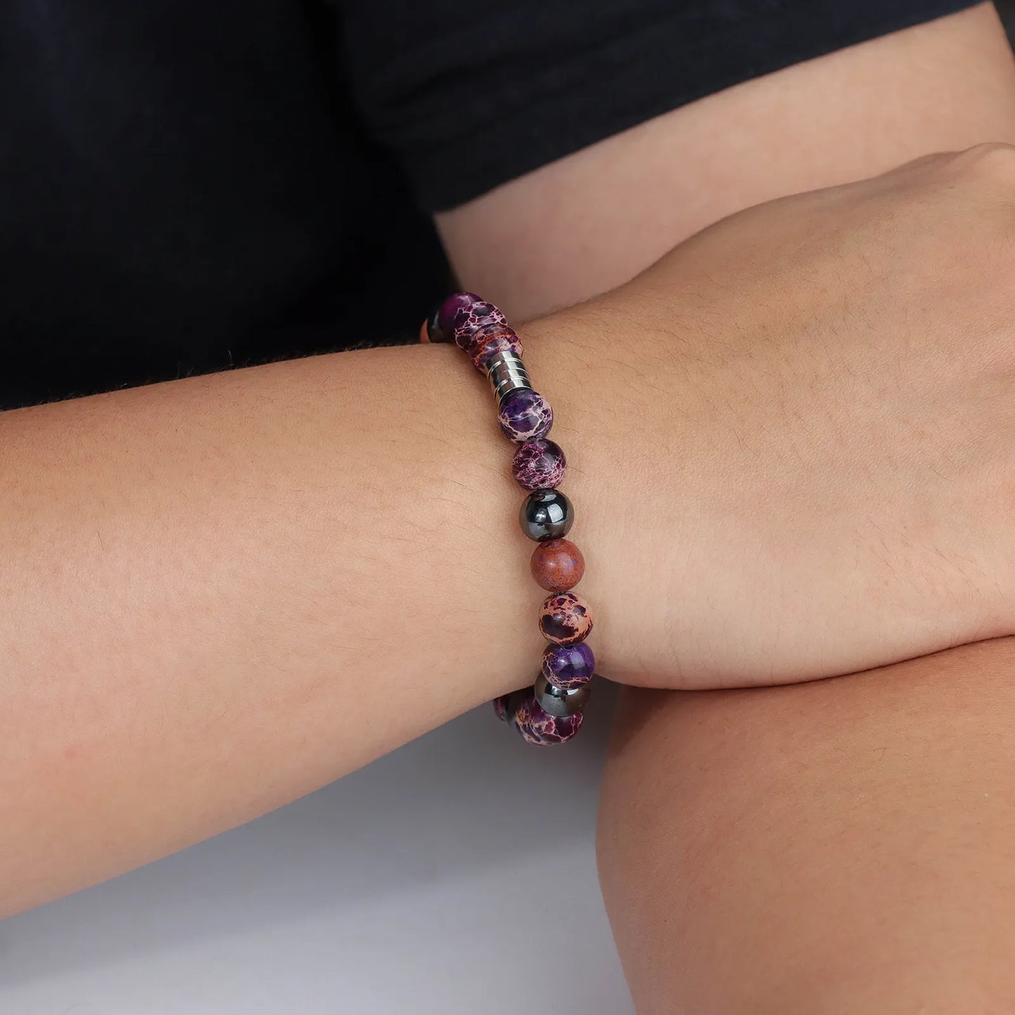 Beaded bracelet with hematite stones and stainless steel, showcasing stylish design for daily wear.