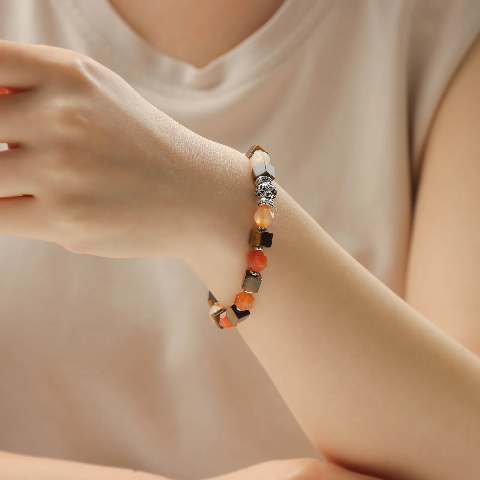 A colorful beaded bracelet with variously colored stones.