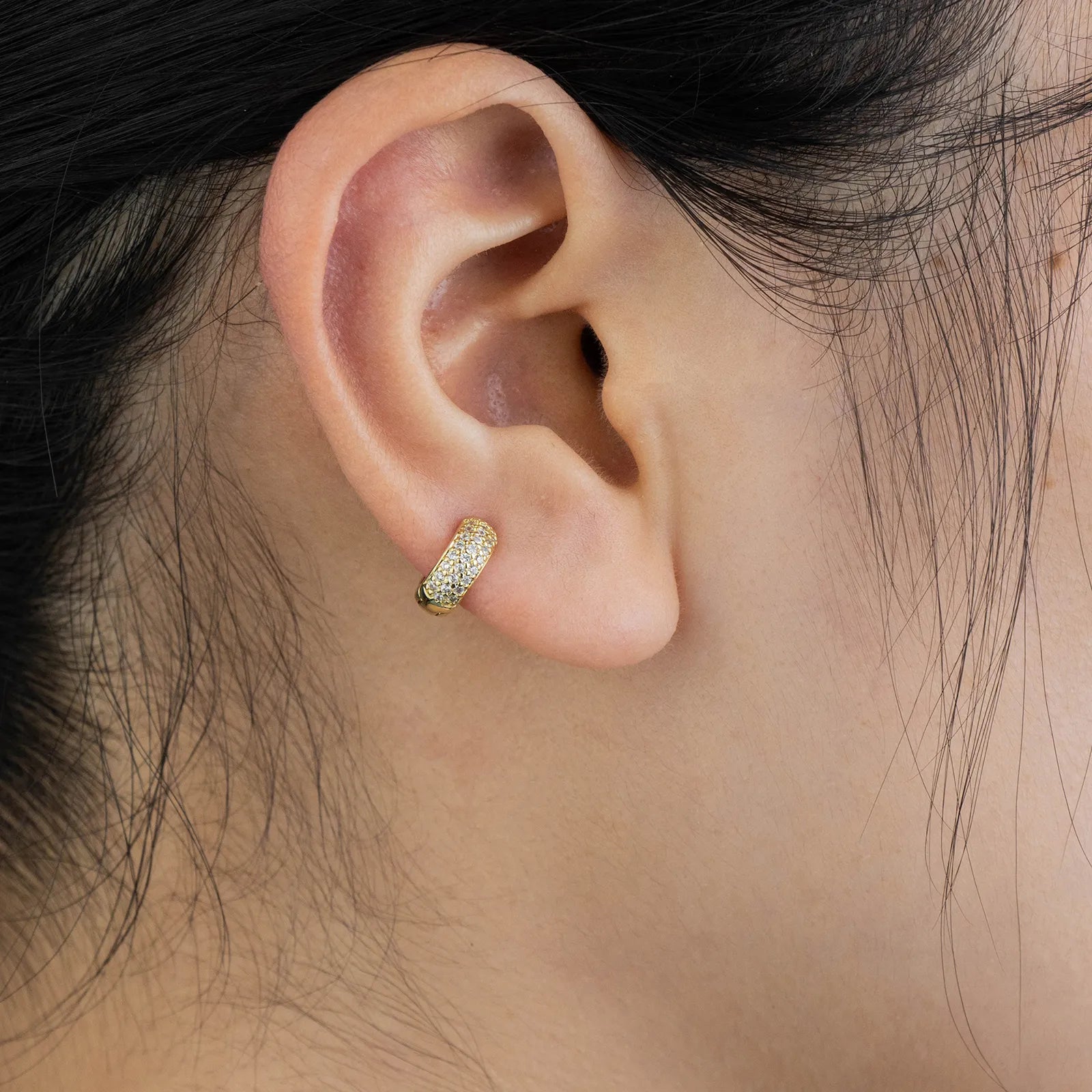 Gold huggie earrings with cubic zirconia, ideal for daily and party styling