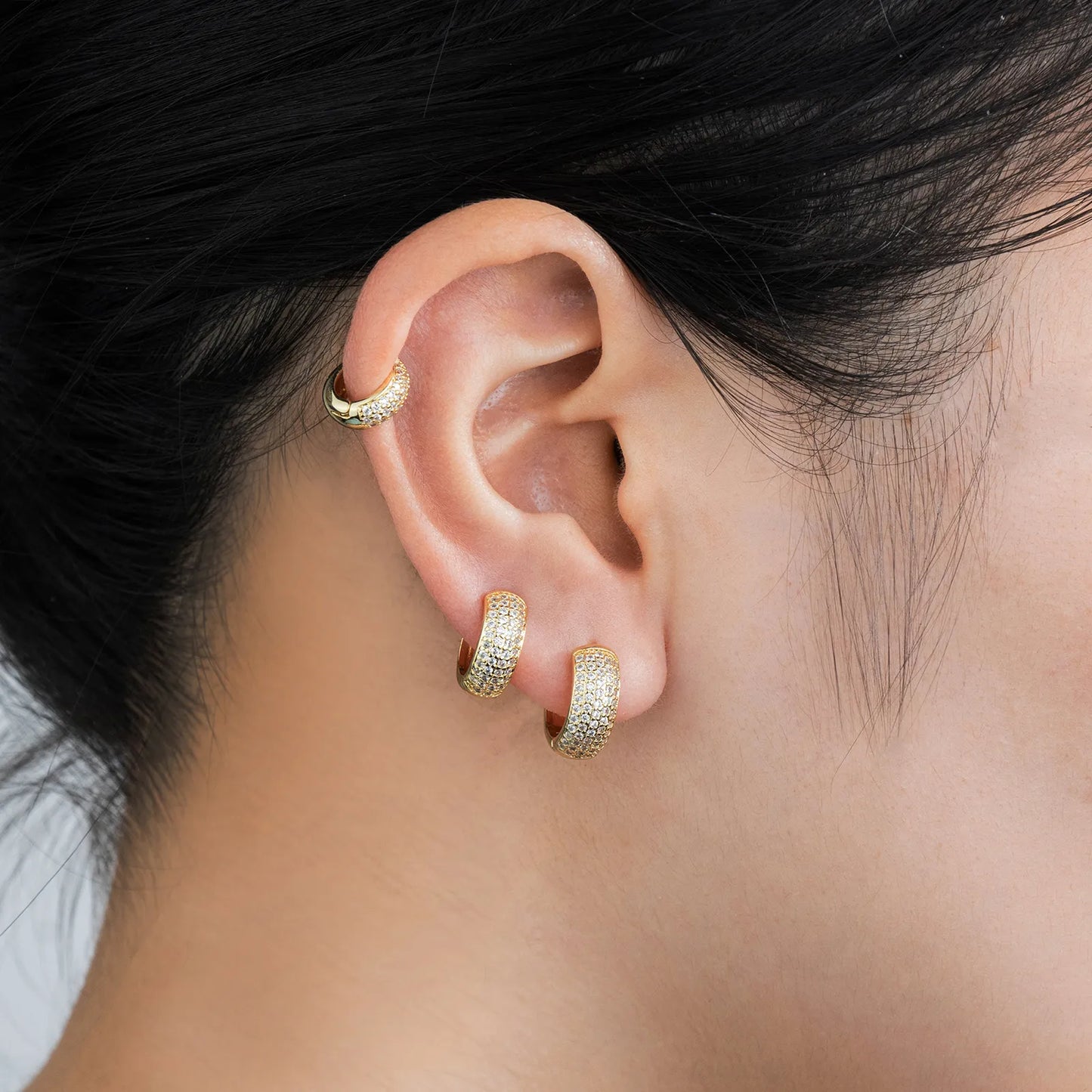 Gold huggie earrings with cubic zirconia, ideal for daily and party styling