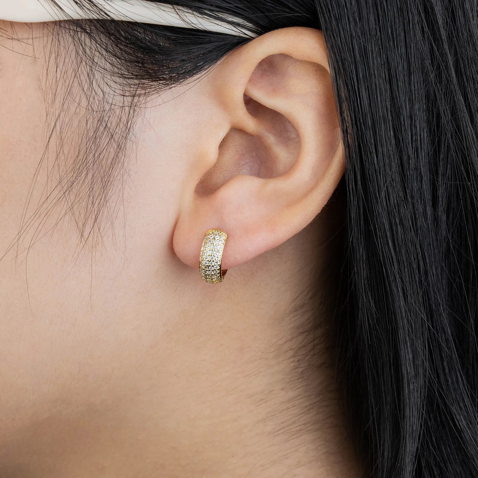Gold huggie earrings with cubic zirconia, ideal for daily and party styling