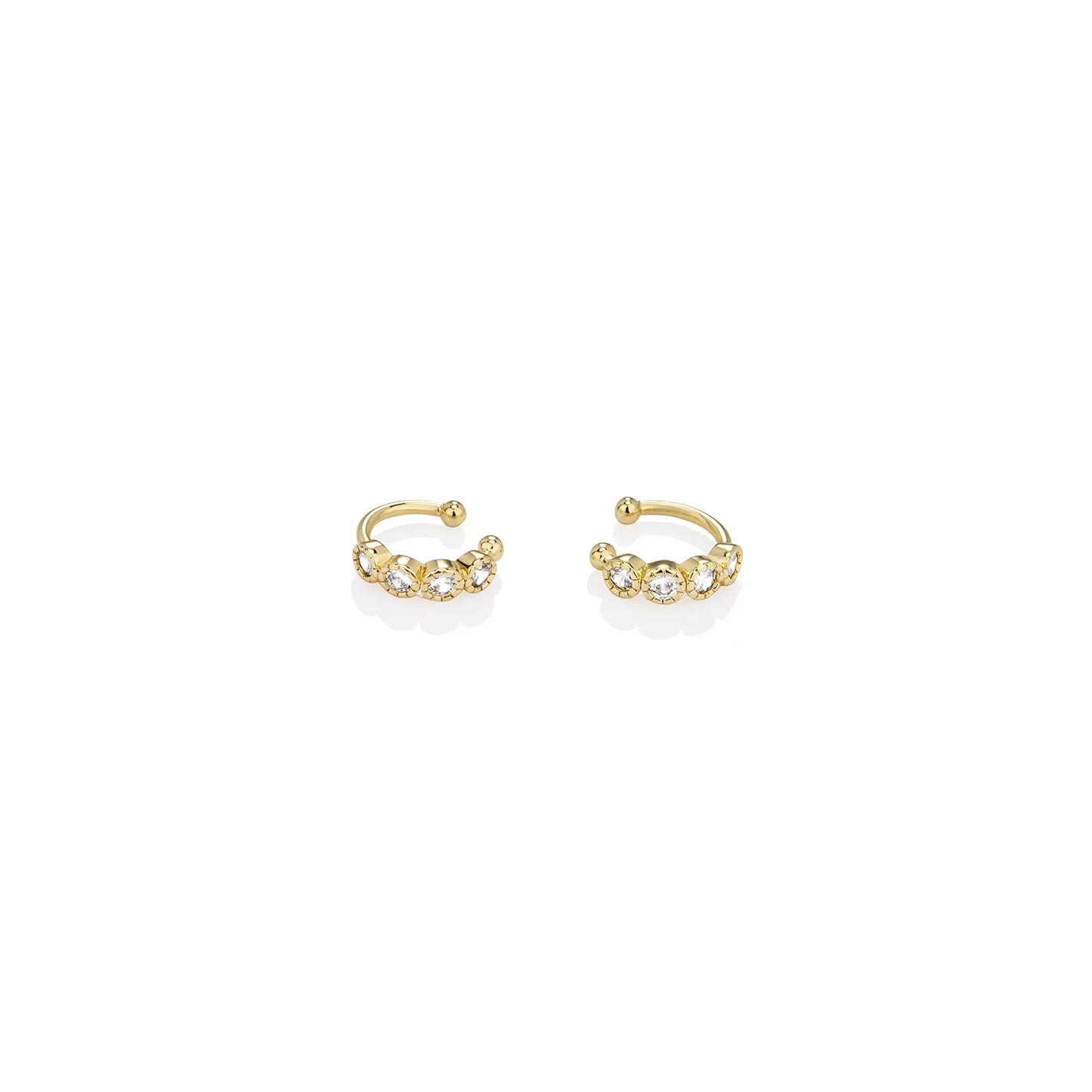 Ajatine gold ear cuffs adorned with zircon stones, perfect for stylish ear jewelry looks