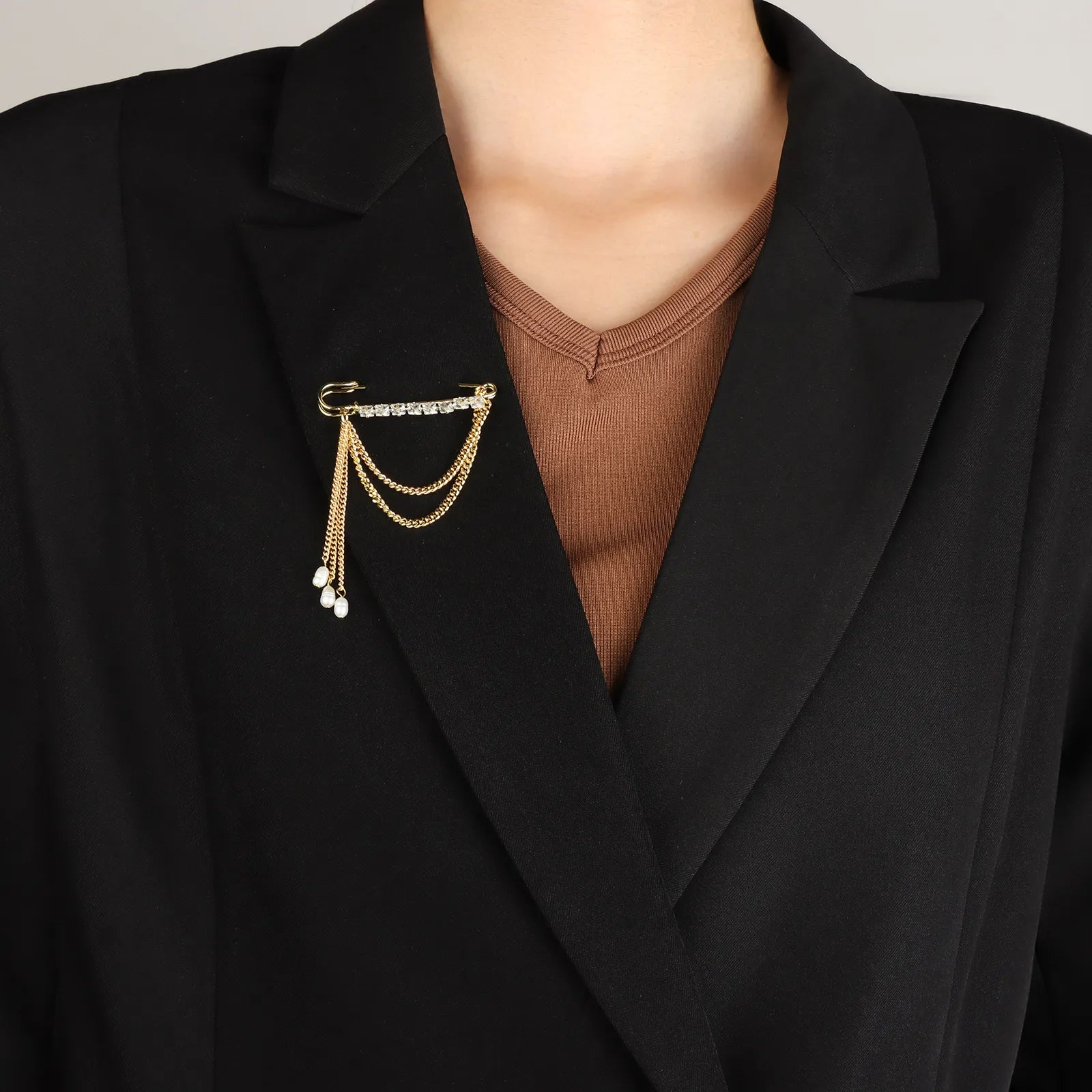 Ajatine safety pin brooch with crystals and pearl tassels, elegant fashion accessory