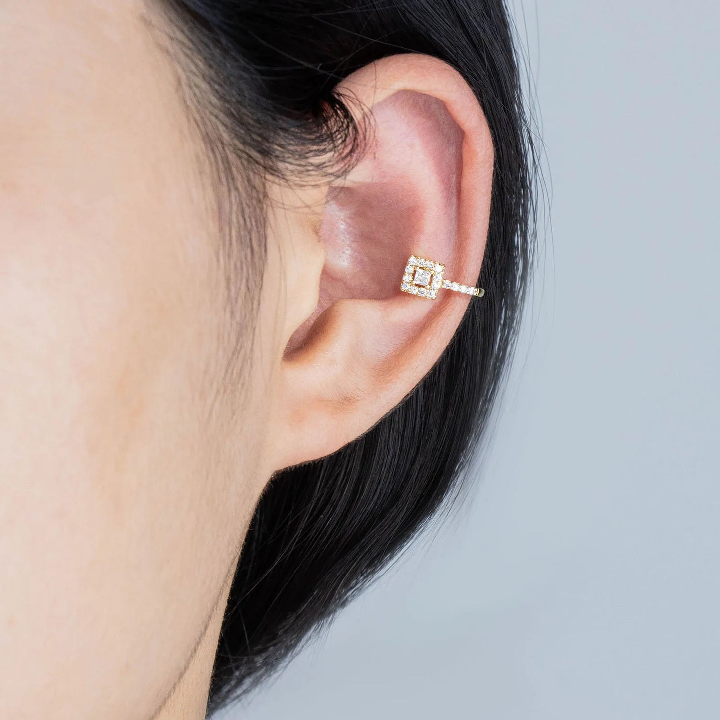 Stunning square CZ clip - on earrings with gold - tone metal for elegant styling