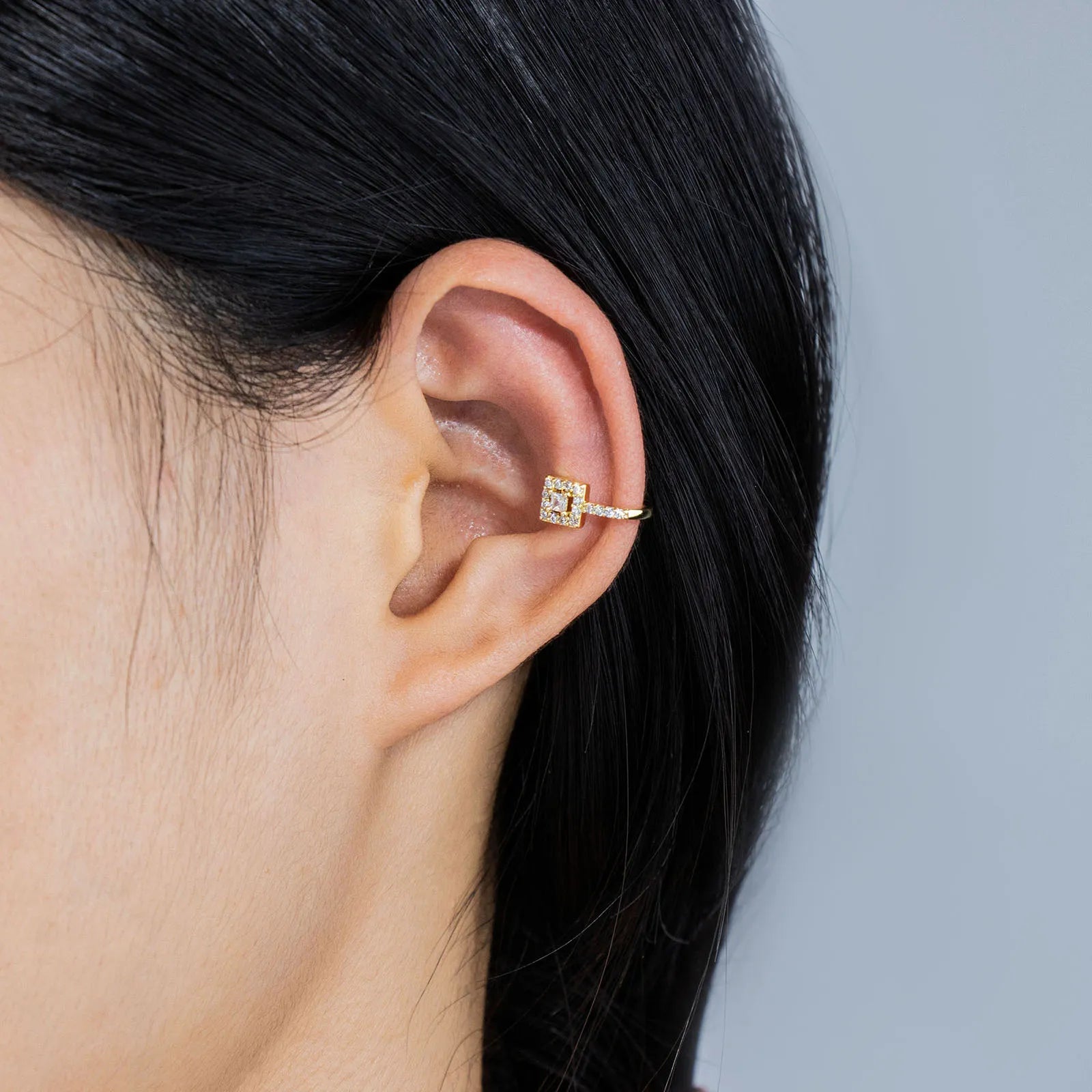 Stunning square CZ clip - on earrings with gold - tone metal for elegant styling
