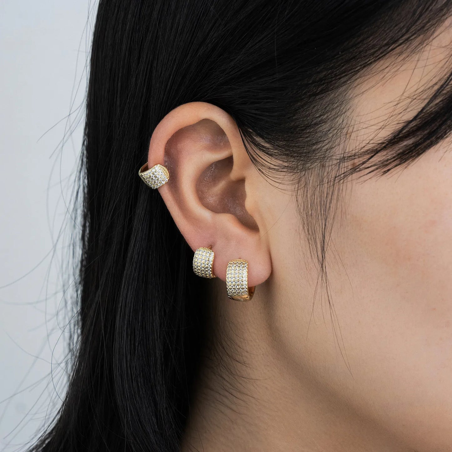 Ajatine brass huggie earrings with wax - set zircon, showcasing elegant design for daily and party wear