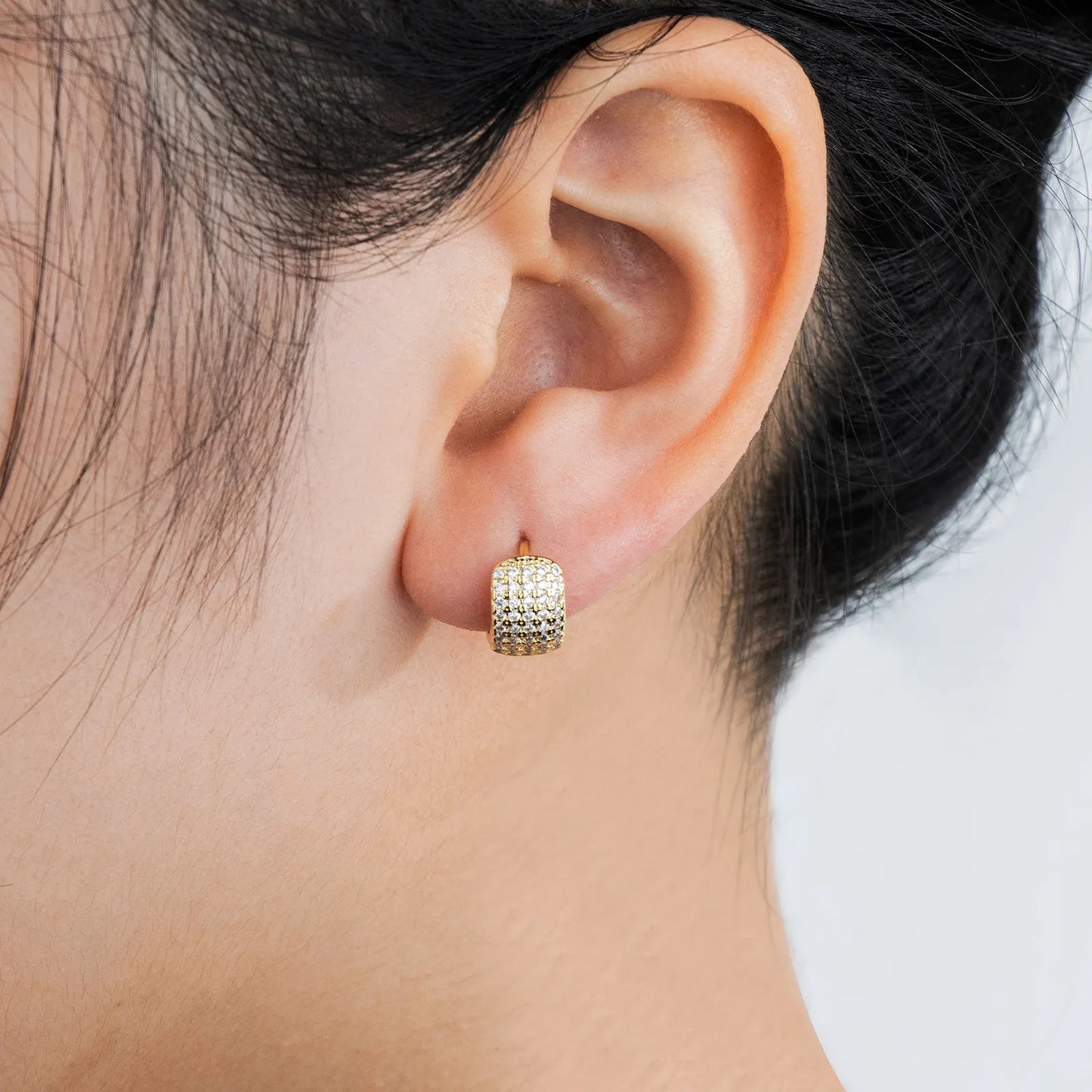 Ajatine brass huggie earrings with wax - set zircon, showcasing elegant design for daily and party wear