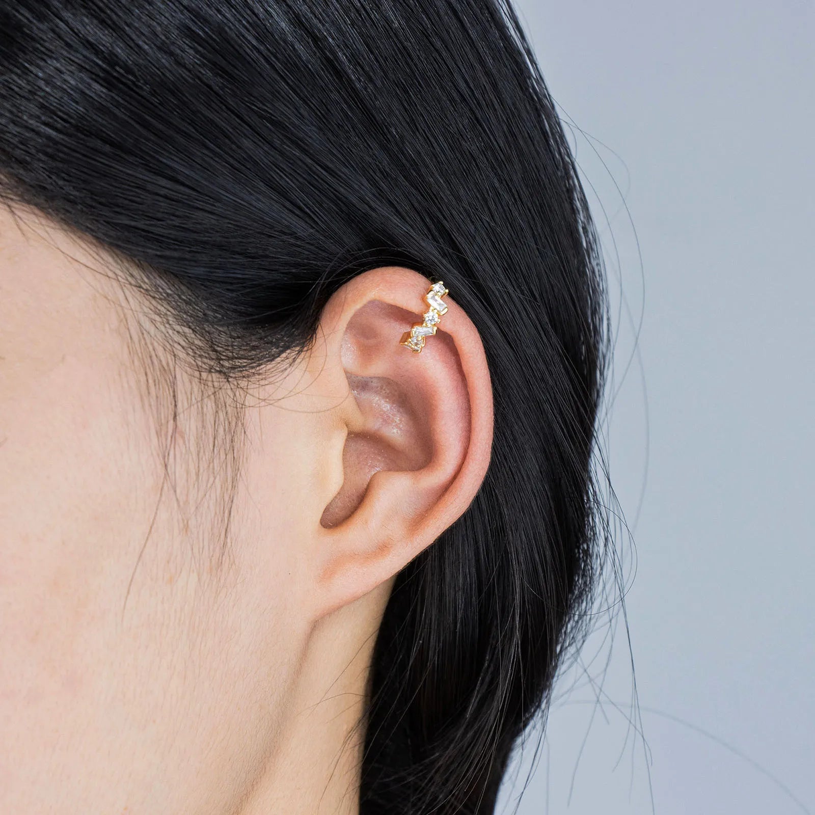 Unique irregular gold cuff earrings with zircon stones, adding artistic style to your look