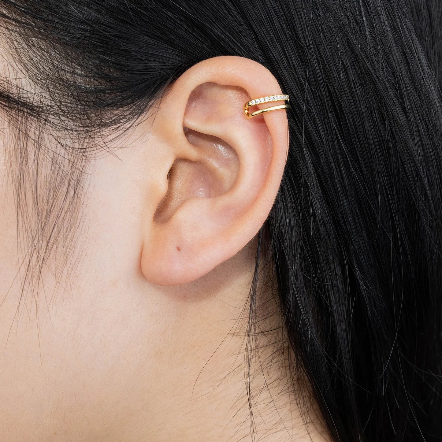 Gold ear cuffs adorned with zircon, minimalist design for stylish wear