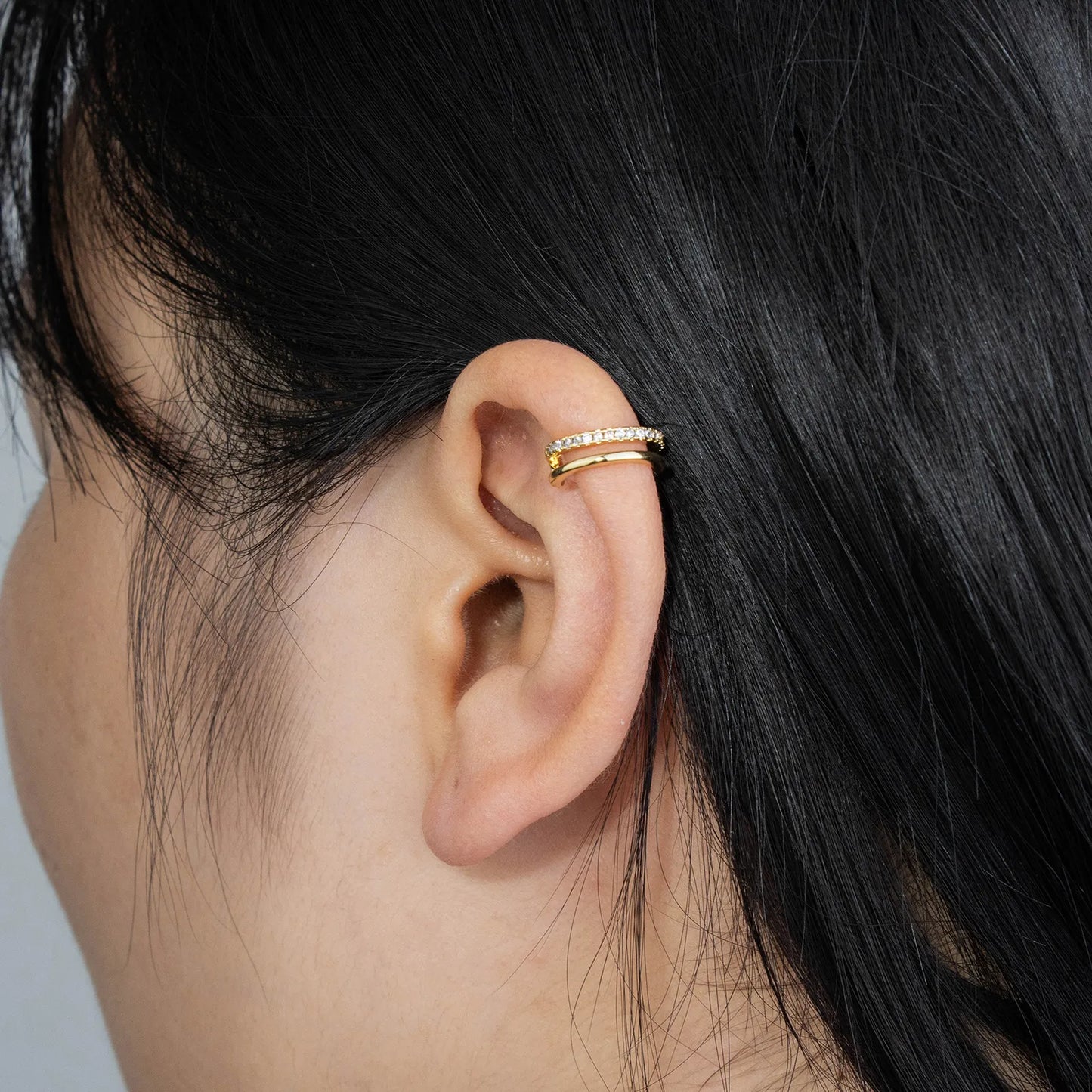 Gold ear cuffs adorned with zircon, minimalist design for stylish wear