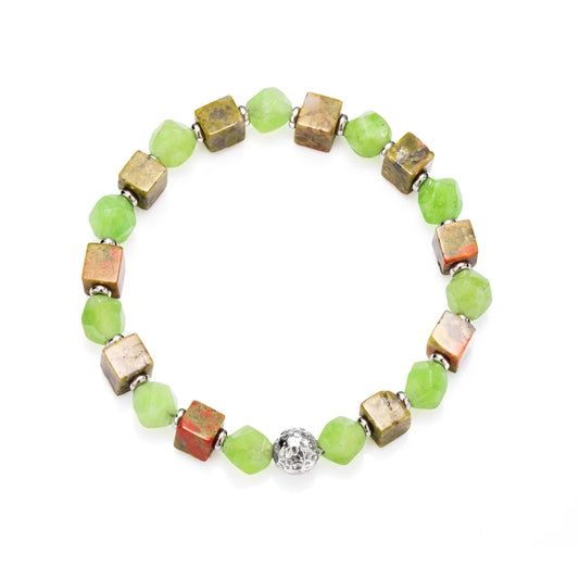 A beaded bracelet with green stones and metallic - colored cubes.