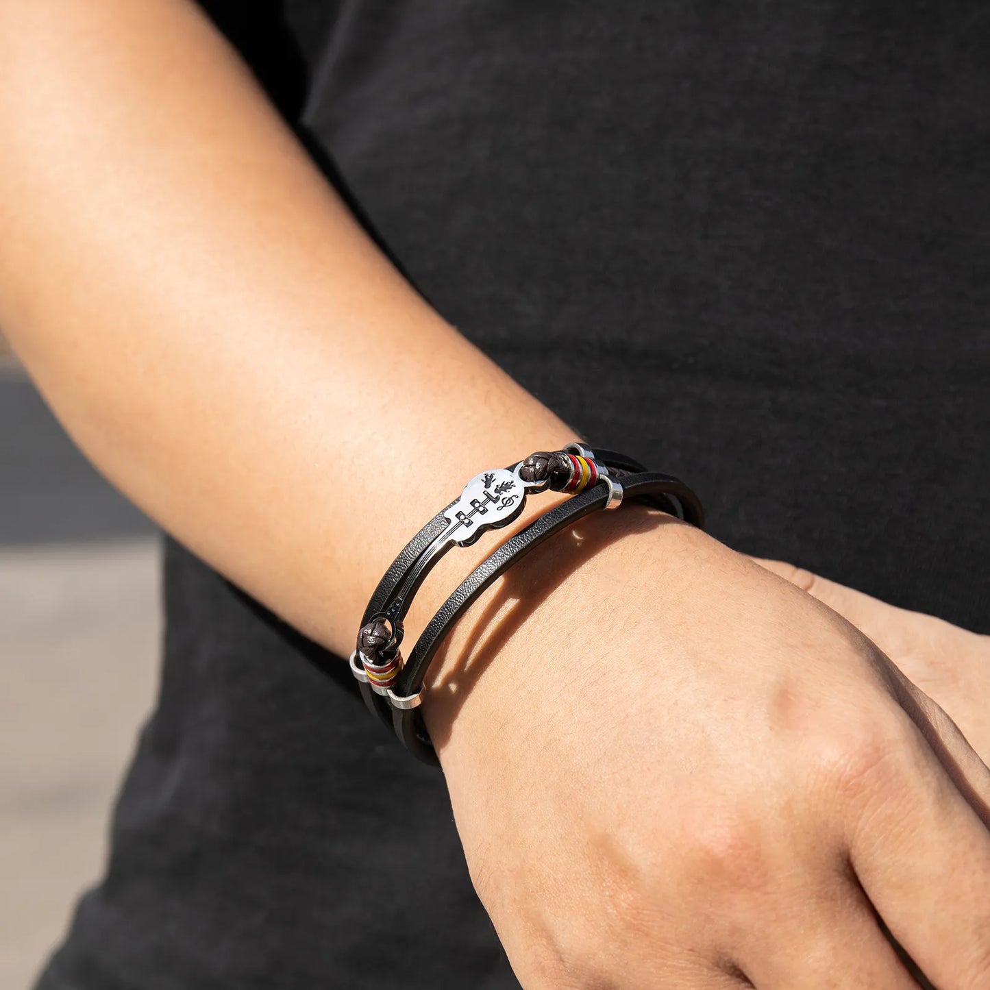 Ajatine leather guitar bracelet with music - themed charm, showcasing premium leather and unique design.