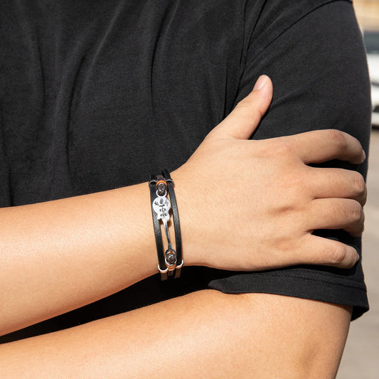Ajatine leather guitar bracelet with music - themed charm, showcasing premium leather and unique design.