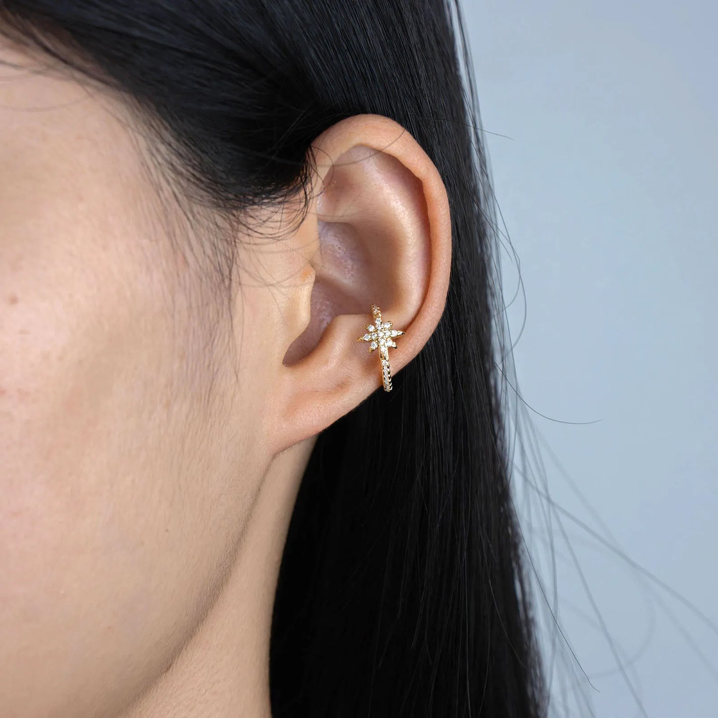 Gold starburst ear cuff with wax-set cubic zirconia for daily and party wear