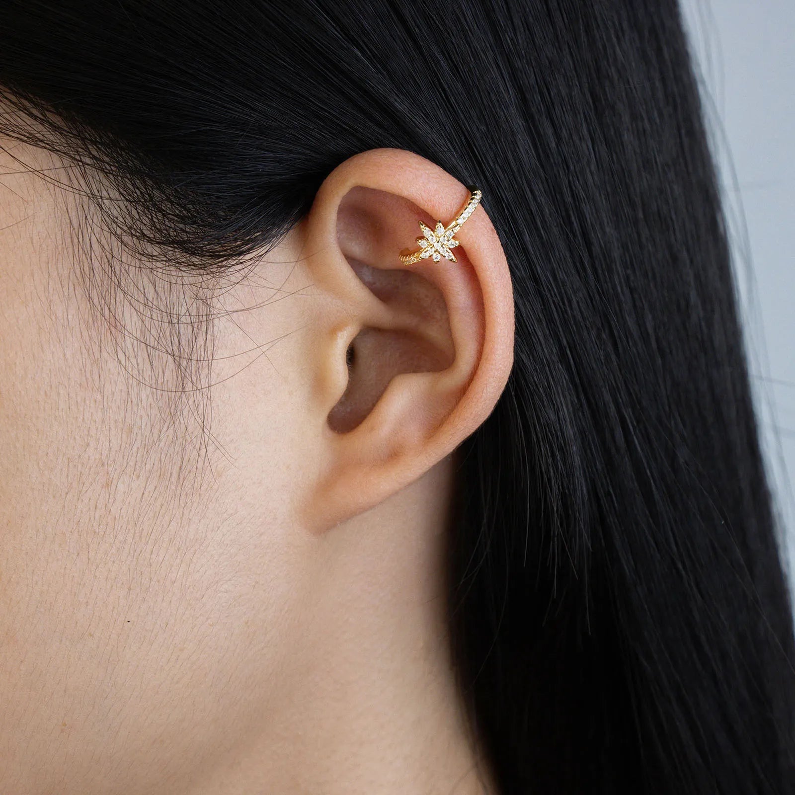 Gold starburst ear cuff with wax-set cubic zirconia for daily and party wear