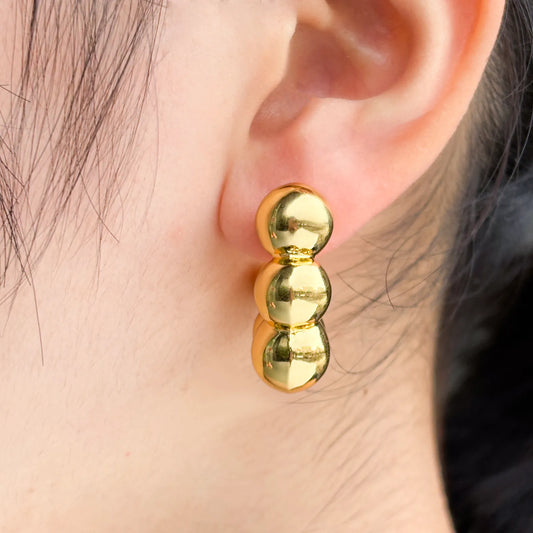 Ajatine beaded hoop earrings with stacked gold ball design, perfect for chic and versatile styling