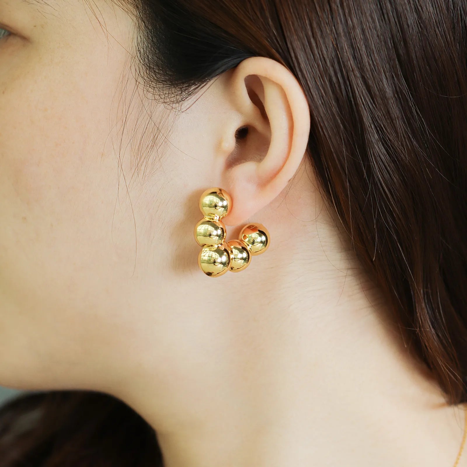 Ajatine beaded hoop earrings with stacked gold ball design, perfect for chic and versatile styling